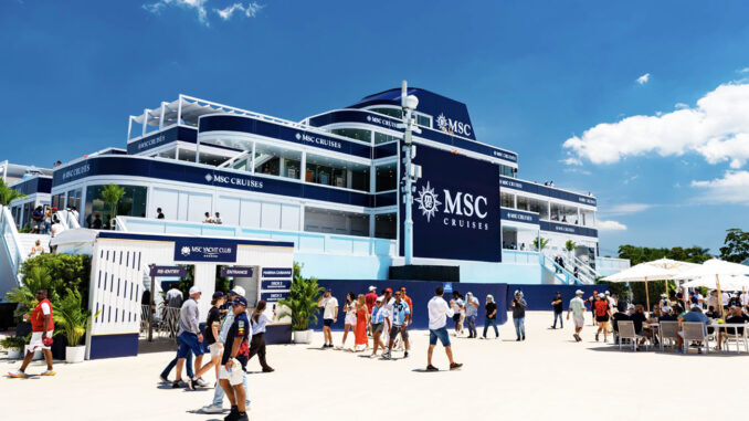 Multi-level MSC Cruises terminal building in blue and white with crowds outside on a sunny day.