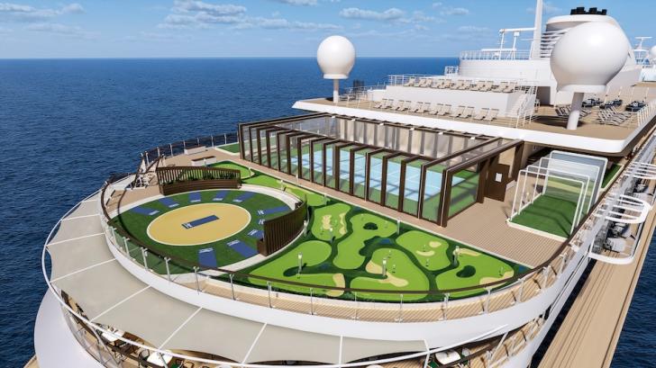 A cruise ship deck featuring a circular mini-golf course adjacent to a glass-walled lounge and a pool, with the ocean in the background, under a blue sky.