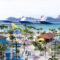 Two large cruise ships docked offshore as a sunny tropical port comes to life with palm trees and colorful buildings along a promenade.